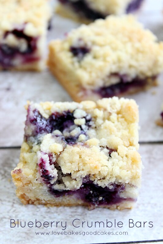 Blueberry Crumble Bars close up on a cutting board.
