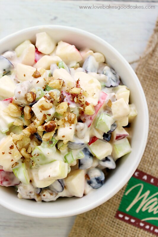 Waldorf Salad with California Walnuts in a white bowl close up.
