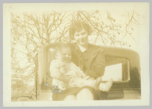 Woman and child on car