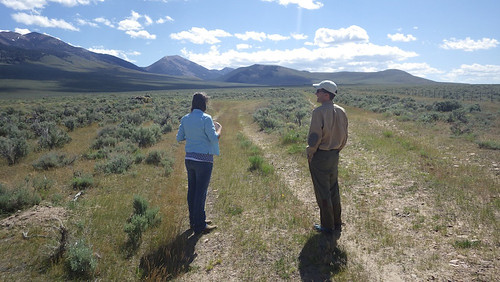 Tom Page and Rosana Rieth check out an area east of the wet meadow where the new perimeter fence has stopped unauthorized motorized access and the rangelands are growing back. (Steve Stuebner photo)