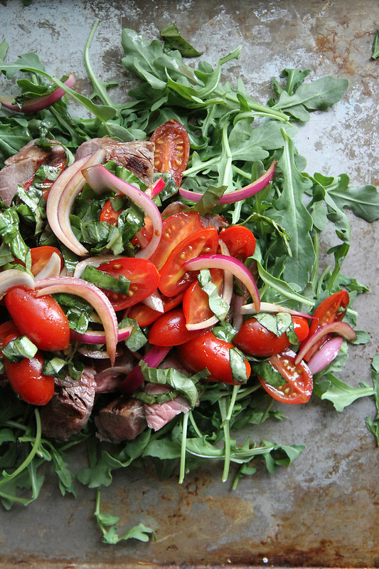 Grilled Steak with Arugula, Cherry Tomatoes, Red Onion and Basil