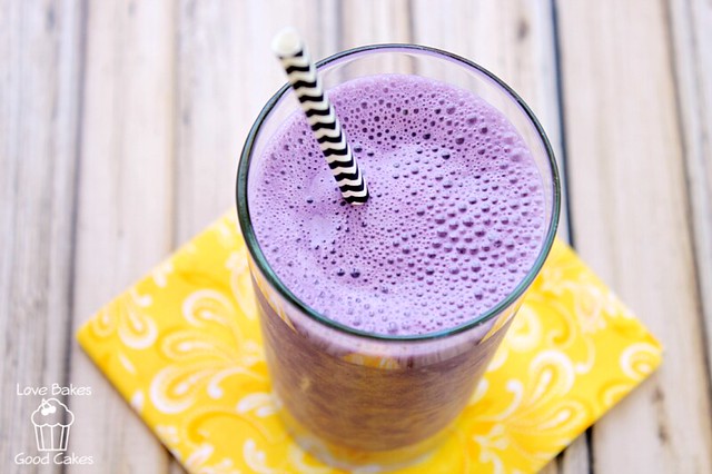 Purple Cow Shake in a glass with a straw. 