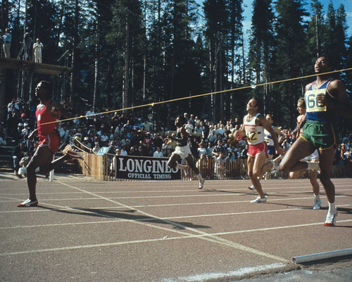 John Carlos breaks the tape and sets a world record of 19.7 seconds in the 200-meter final during the Olympic Trials in September 1968. Tommie Smith (right) placed second, and Larry Questad (red shorts and white jersey) was third. (Courtesy Track & Field News/Rich Clarkson)
