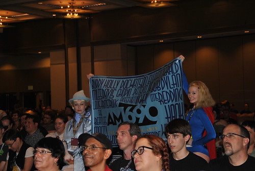 AM 1690 banner held up in the audience for the Sunday night show.