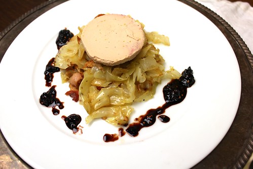 Duck foie gras with bacon and juniper-flavored cabbage and blackberry mustard seed gastrique