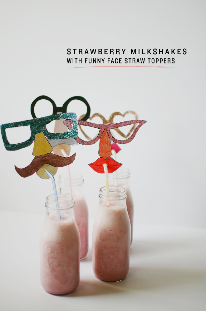 strawberry milkshakes with funny face straw toppers