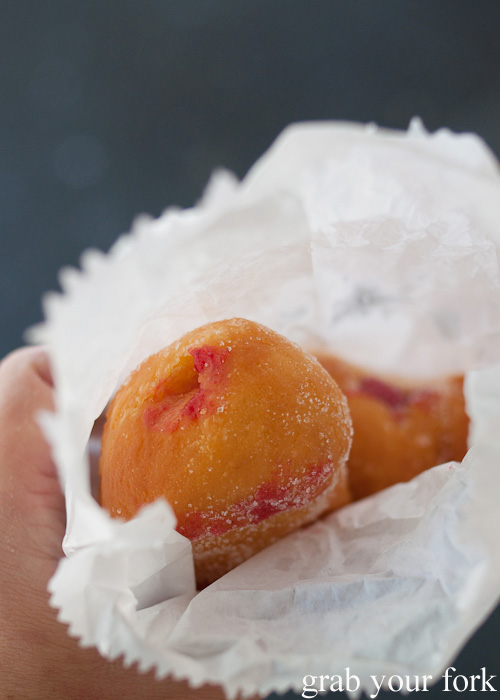 Hot fresh raspberry jam doughnuts at American Doughnut Kitchen, Queen Victoria Market, Melbourne
