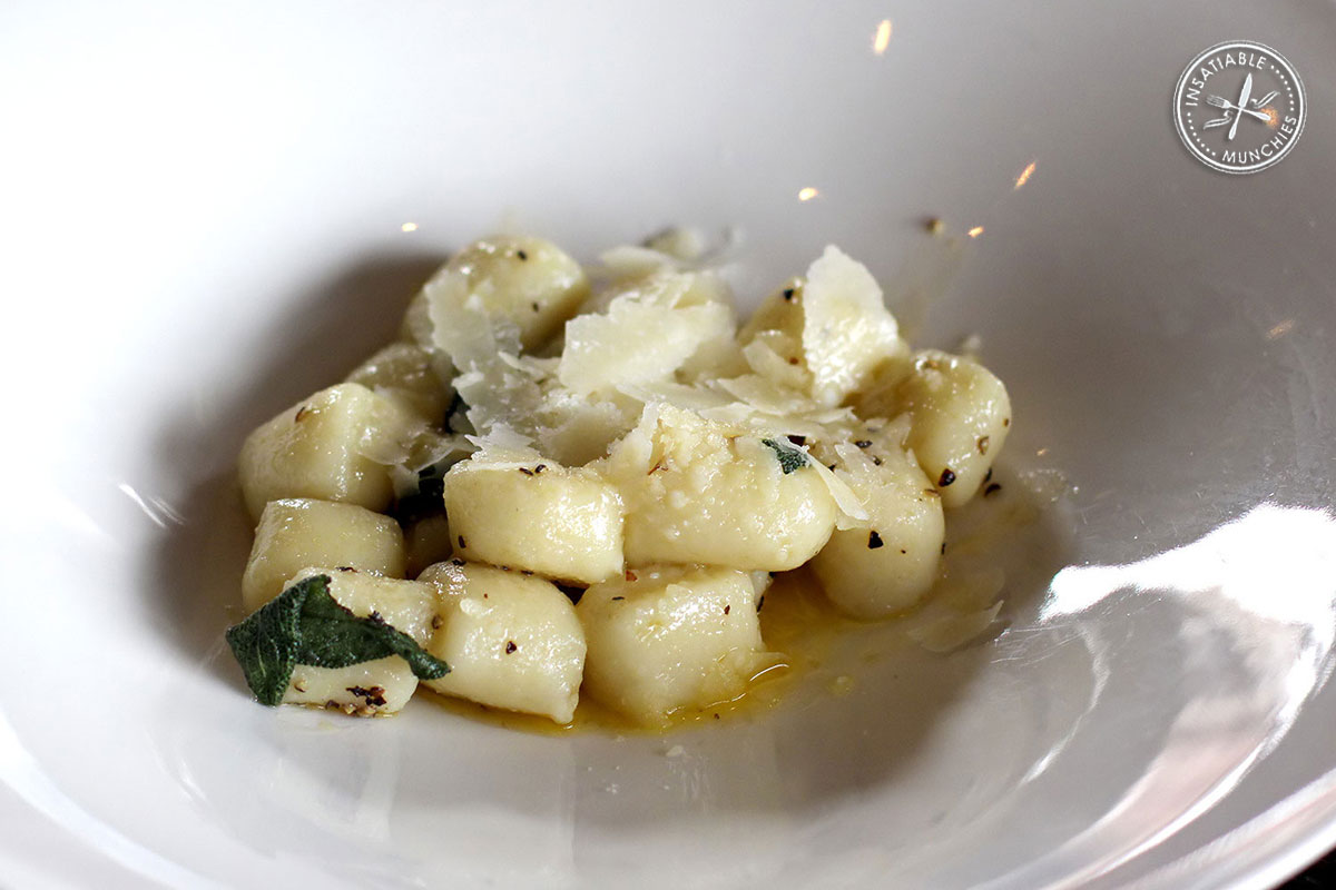 Soft, pillowy gnocchi is lightly sautéed in sage and butter, and topped with shaved cheese.