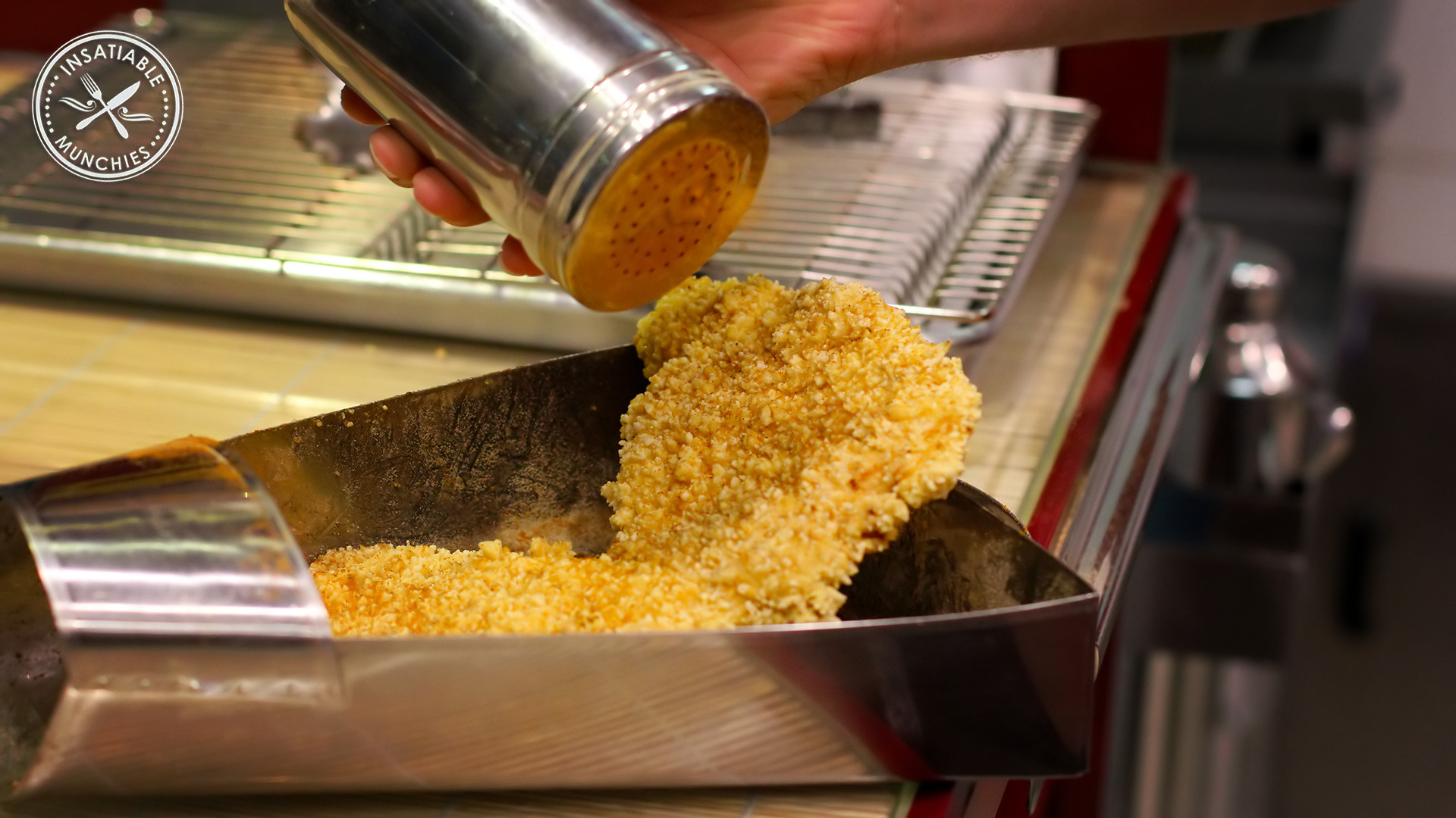 XXL Crispy chicken, getting seasoned before being cut up for the order