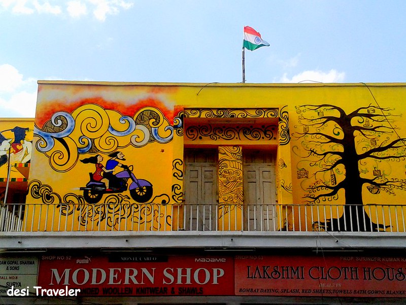 A couple on Bike on Delhi Streets Tricolor Flag Tree with gifts