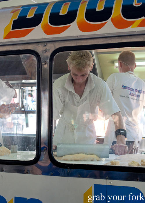 Rolling out doughnut dough at American Doughnut Kitchen van at Queen Victoria Market, Melbourne