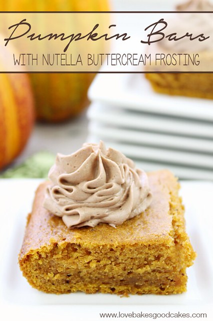 Pumpkin Bars with  Nutella Buttercream Frosting on a stack of white plates.