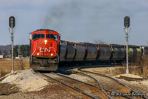 cn canadiannational ic tennessee tipton rural cn5606 ic6032 wc7508 wc6508 bn6508 icg6032 emd sd70 sd402 sd45 illinoiscentralgulf icg bn burlingtonnorthern wc wisconsincentral g87091 illinoiscentral covington rialto fultonsub fultonsubdivision fultondistrict unit engine locomotive signal light rail railroad railway train track power horsepower scanlon canon eos digital freight transportation merchandise commerce business haul outdoor outdoors move mover moving rebel sd70i