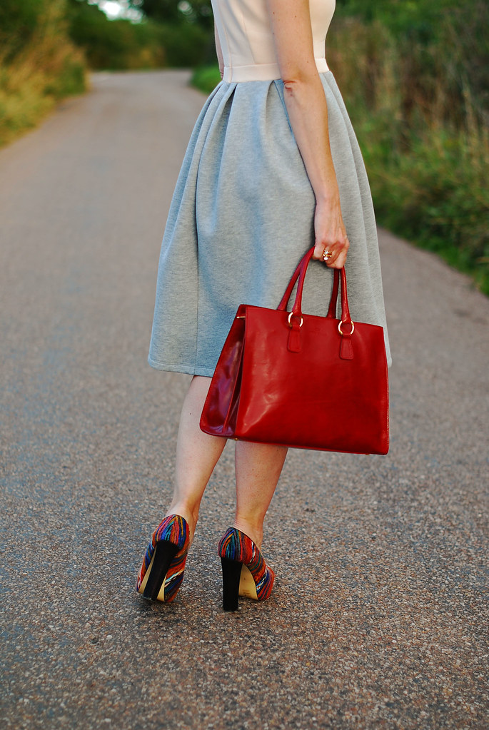 Two-tone full skirted dress and red tote