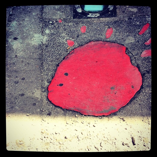 Sarajevo Rose -- filled holes caused by mortar explosions where someone has died. (One of over 100)