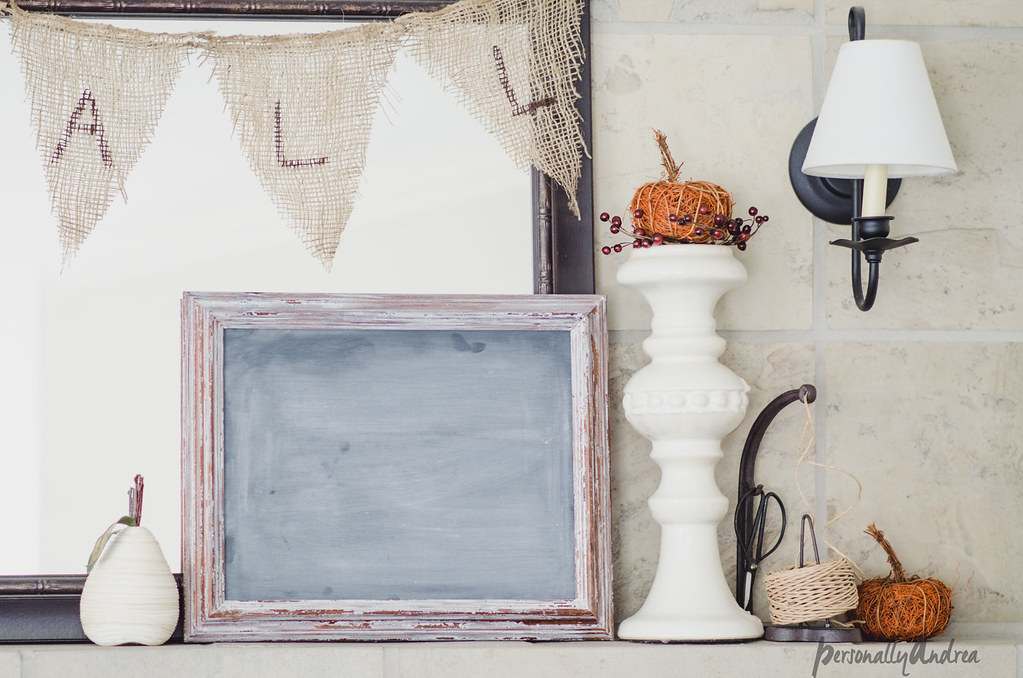 Fall mantel with mirror, chalkboard, pumpkins, books, candlesticks and burlap banner | personallyandrea.com