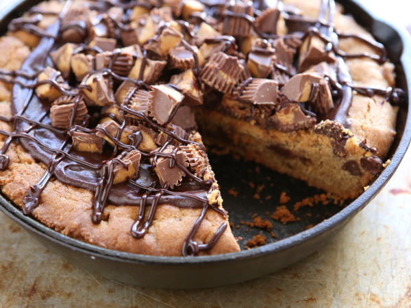 Reese's Peanut Butter Chocolate Chip Cookie Cake from completelydelicious.com