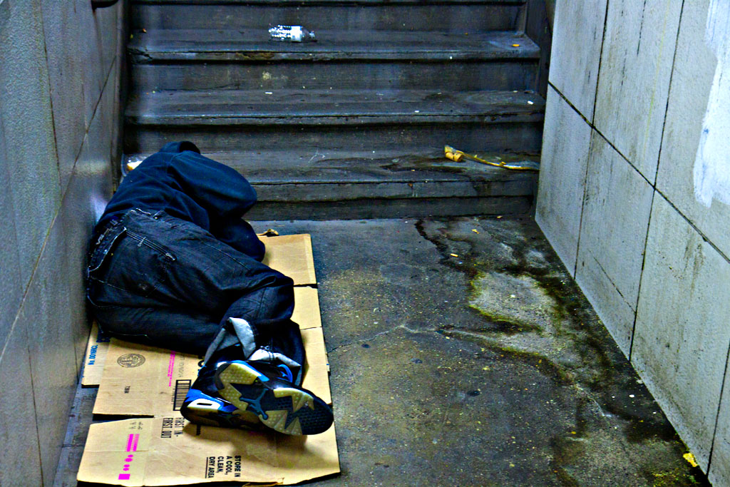 Man-sleeping-at-bottom-of-subway-entrance-on-9-16-14--Center-City