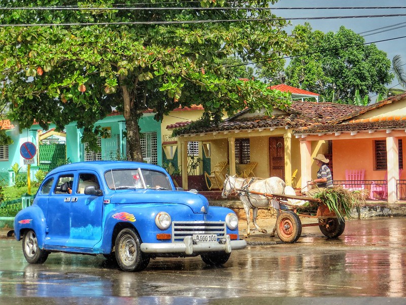 A horse cart and car in Cuba