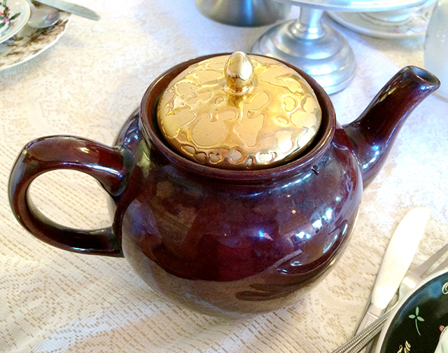 gold and maroon/oxblood teapot