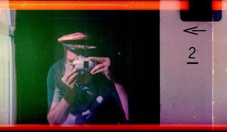 reflected self-portrait with Plane Cam and pilot's hat
