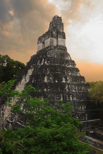 city trees sky orange history abandoned archaeology latinamerica clouds forest sunrise mesoamerica lost temple dawn ancient rainforest maya guatemala nopeople unesco worldheritagesite mayan jungle tikal mysterious civilization archeology centralamerica peten archaeologicalsite builtstructures