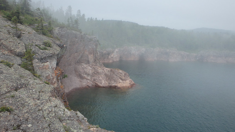 cliffs along Lake Superior, partially obscured by fog