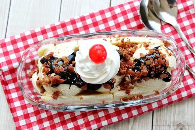 Elvis Banana Split with Homemade Peanut Butter Ice Cream in a dish with two spoons.