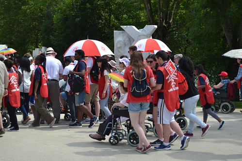 Red Caps helping pilgrims in Lourdes