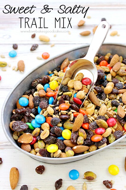 Sweet & Salty Trail Mix in a metal pan with a scoop.