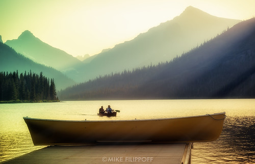 park sunset lake mountains boat dock montana day glow dusk ngc smooth paddle calm canoe glacier adventure clear explore national serene canoeing majestic placid twoperson