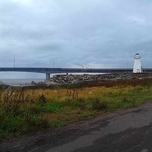 The Confederation Bridge and a lighthouse,  seen from the old ferry dock #princeedwardisland #pei #bordencarleton #bridges #confederationbridge #fixedlink #ferries