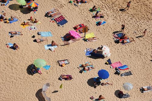 ocean summer eye beach portugal birds sand women view skin atlantic bikini females sunbathers nazare