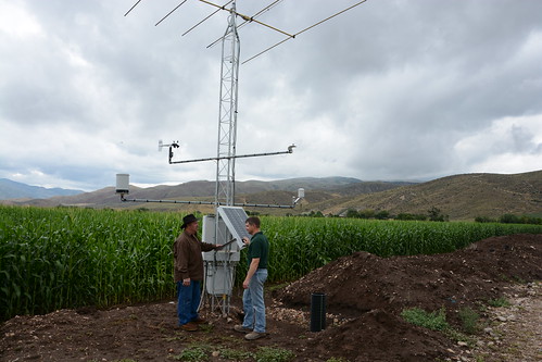Utah dairy farmer Dee Waldron (left), checks out the NRCS SCAN site on his farm with NRCS Soil Scientist Kent Sutcliffe, Utah’s SCAN coordinator. Climate and soil moisture sensors send data to online sites where farmers and other water managers can access information to help with management decisions.