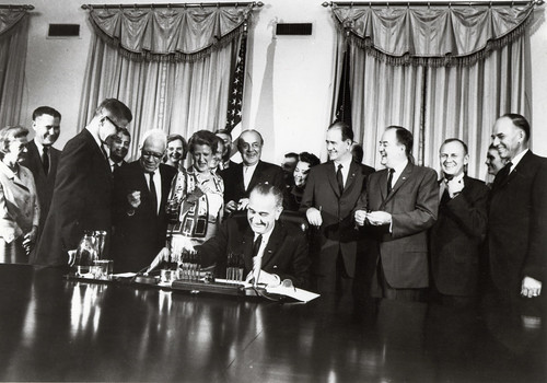 President Johnson signing the Food Stamp Act of 1964.