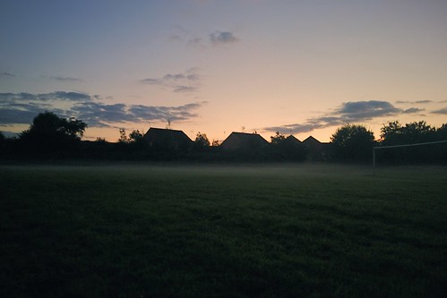 houses sunset sky dog mist green field grass misty fog skyline clouds evening goal twilight low meadow layer pitch