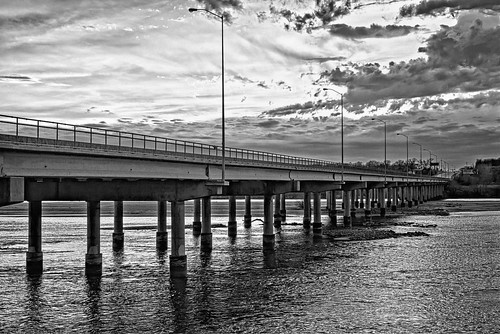 d610 nikon50mmf18d clouds evening lowlight tulsa colorefex niksoftware silverefex bridge 71ststreetbridge sunset sunsetlight saturatedslidefilmeffect arkansasriver oklahoma water river