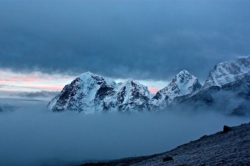 the clouds start to clear the mountains before sunrise on Kala Patthar