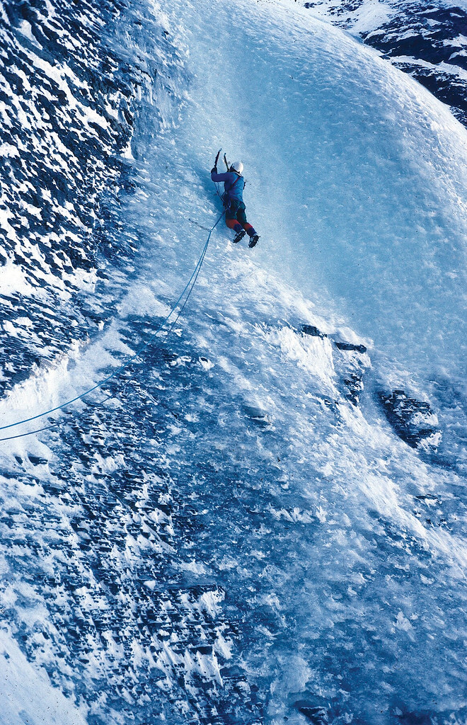 T. P. Friesen planting ice picks and crampons into the.exit bulge of the Andromeda Strain—ice that had never.been touched by man. Canadian Rockies. Photo: David Cheesmond
