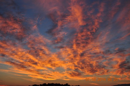 blue sunset red orange black clouds star burst