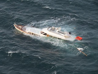The Lady A, a 67-foot recreational vessel, sinks in 180 feet of water north of Dungeness Spit, Sequim, Wash., following the rescue of two people aboard by a small boat crew from Coast Guard Station Port Angeles, Oct. 17, 2014. The two people were taken to the station with no reported injuries. (U.S. Coast Guard photo courtesy of Coast Guard Air Station Port Angeles)