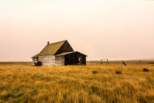 old school autumn brown cold building fall abandoned field grass horizontal yard rural vintage dark landscape countryside wooden montana alone moody loneliness mt exterior antique decay empty small neglected dream landmark ghosttown historical weathered lonely homestead snowing prairie copyspace schoolhouse clearsky grassy fallingapart greatplains playgroundequipment colorimage oneroom illiad chouteaucounty