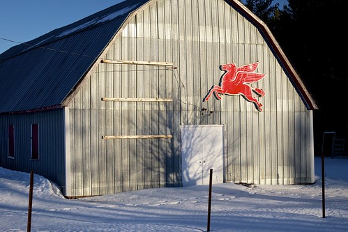49789 agriculture architecture barn building chippewacounty curve fairground flyingredhorse fujixt1 m48 michigan mobil pegasus stalwart sunny unitedstates upperpeninsula winter xf1855mm