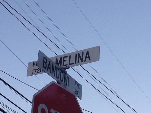 Via Melina and Bandoni street sign