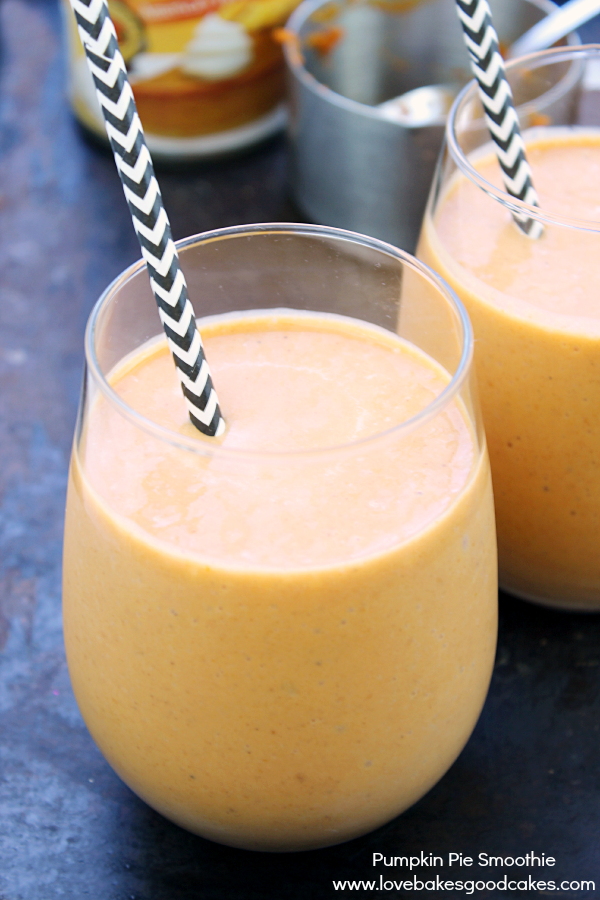 Pumpkin Pie Smoothie in glasses with straws.