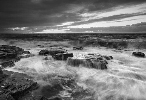 sunset sea blackandwhite bw beach water mono seaside rocks wave olympus rough zuiko omd parton westcumbria seawaves 1260mmzuiko olympusomdem1