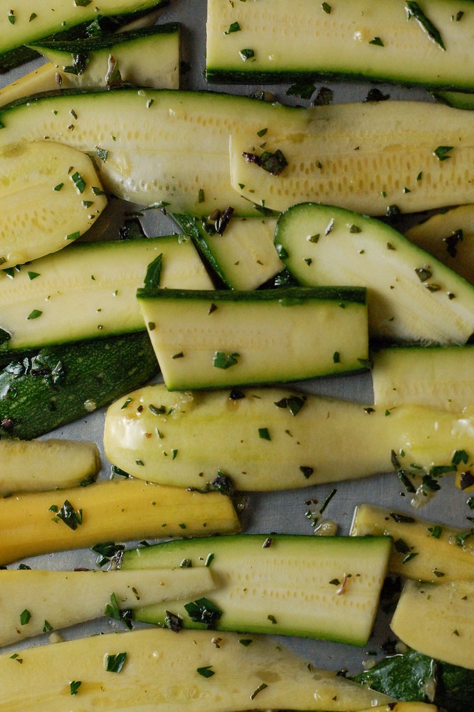 Roasting summer squash with herbs and garlic for the harvest lasagna by Eve Fox, The Garden of Eating, copyright 2014