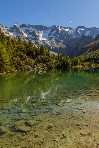 wood sky mountain lake snow reflection tree nature water stone landscape top ngc sunny natura summit peack aviolo