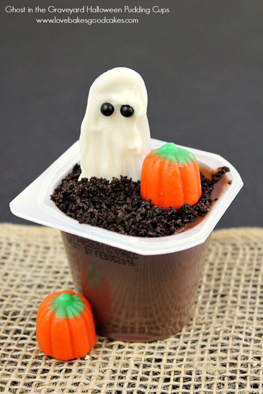 Ghost in the Graveyard Halloween Snack Pack Pudding Cups with candy on top.