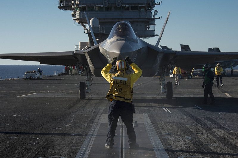 An F-35C Lightning II is prepared for launch aboard USS Nimitz.
